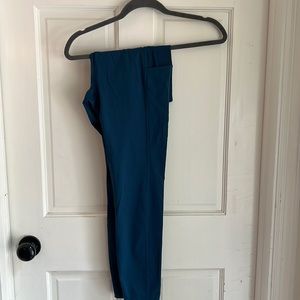 Amazon leggings never worn with still tags on. A darker teal blue with pockets